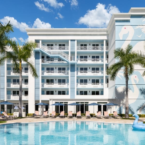 Exterior shot of Blue Flamingo pool with inflatable swan