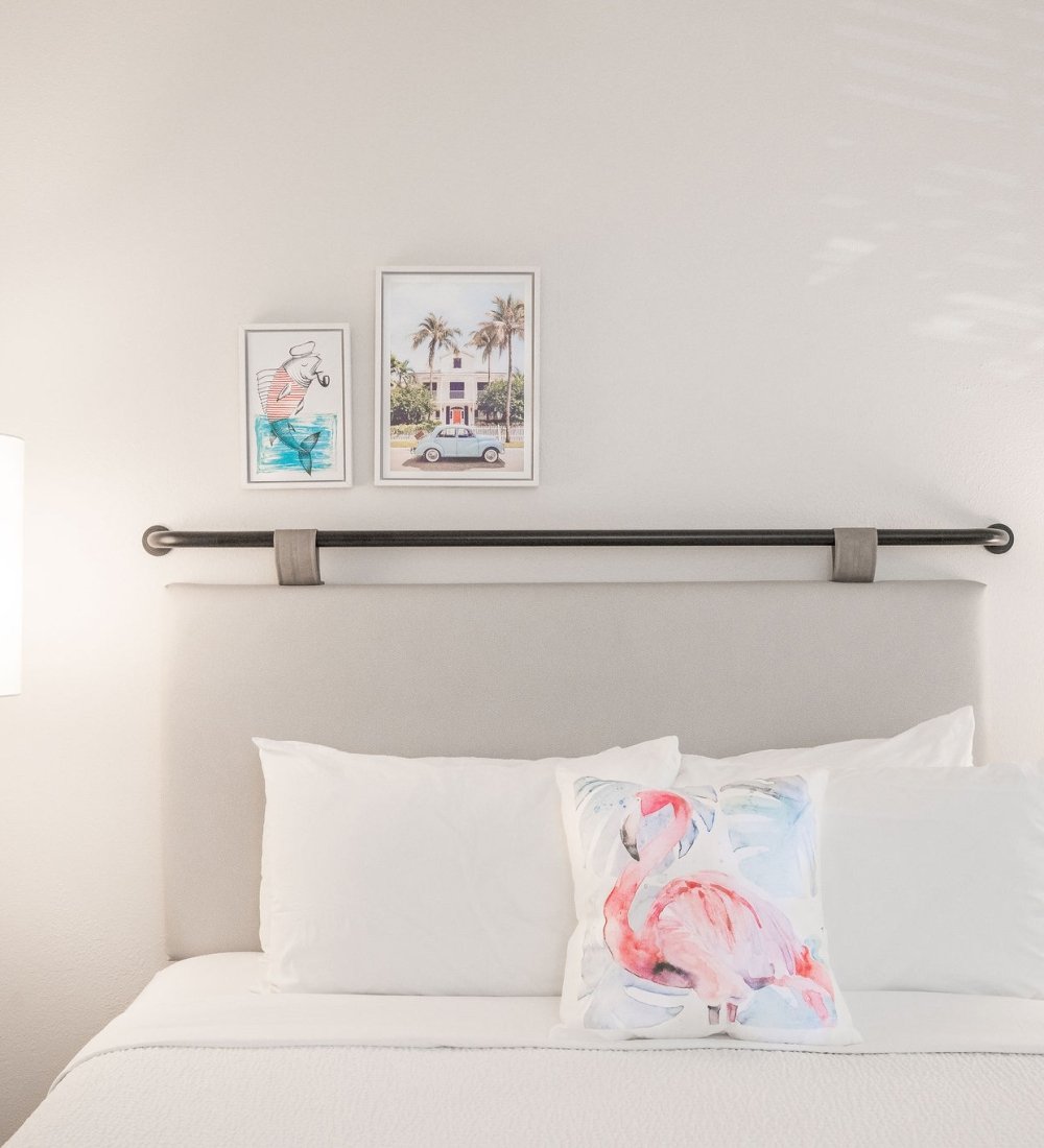Flamingo pillow on a queen bed