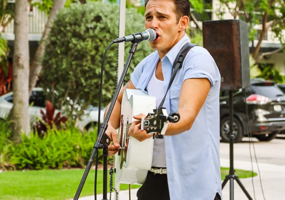 Man playing guitar and singing