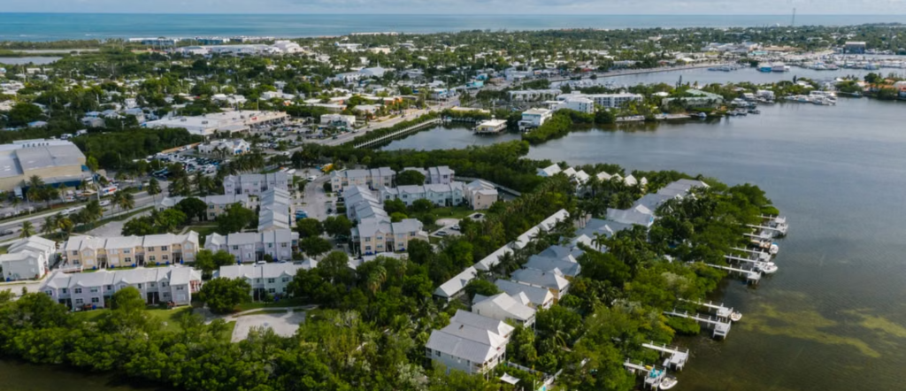 Aerial view of Key West’s waterfront, tropical neighborhoods and surrounding blue water