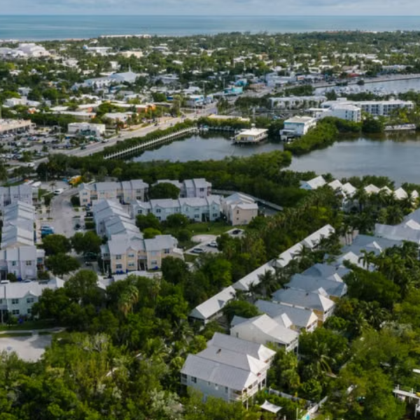 Aerial view of Key West’s waterfront, tropical neighborhoods and surrounding blue water