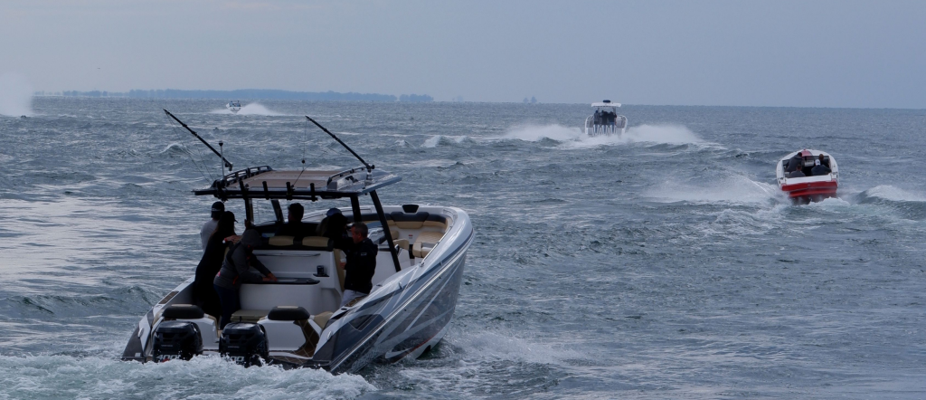 High-speed powerboats racing across choppy ocean water