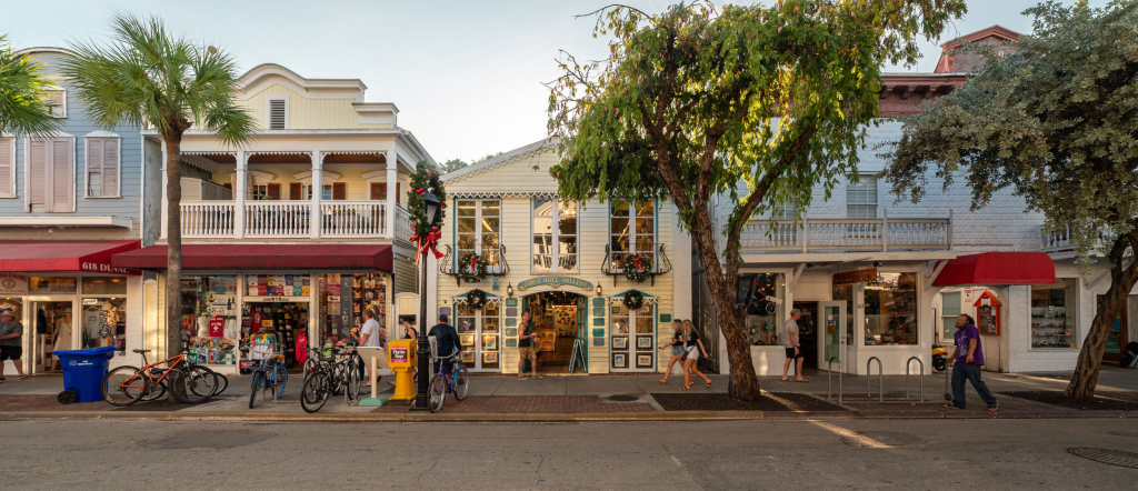 Bicycles parked outside colorful shopfronts on Duval Street in Key West, Florida