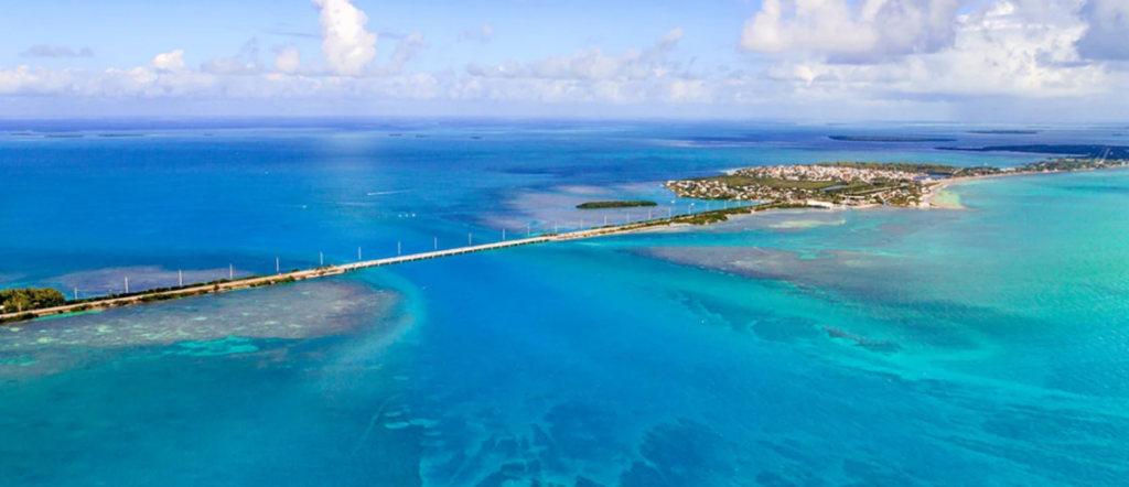 Clear blue water and shaded shoreline at Fort Zachary Taylor State Park in Key West